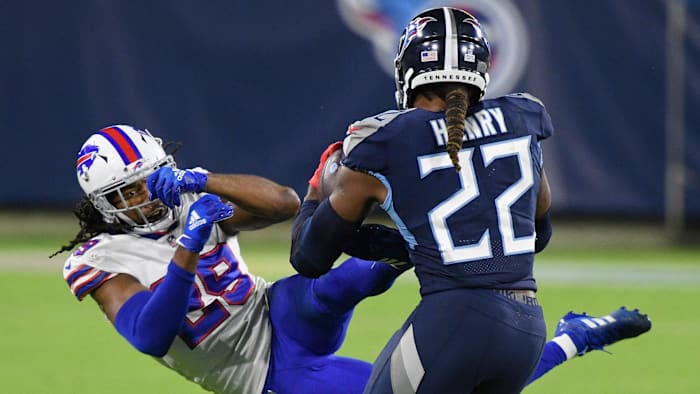 Tennessee Titans running back Derrick Henry (22) tosses Buffalo Bills cornerback Josh Norman (29) during the second quarter at Nissan Stadium Tuesday, Oct. 13, 2020 in Nashville, Tenn. An57980